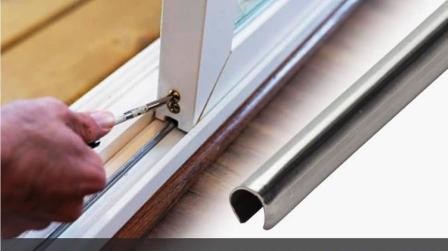 Technician making precision micro-adjustments to roller height screws with specialized tools to level and align sliding glass door panel