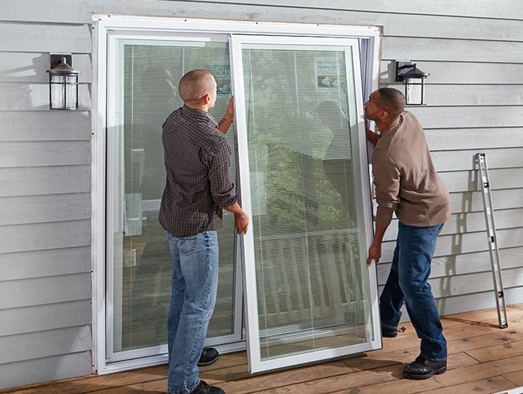 Licensed contractor installing hurricane-rated impact door frame system
